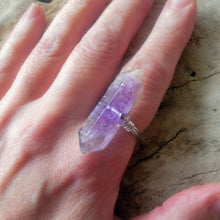 Load image into Gallery viewer, Amethyst crystal ring on a finger for scale