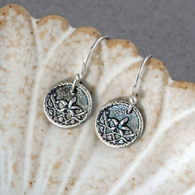 Load image into Gallery viewer, Silver earrings with intricate designs on a shell shaped dish