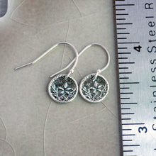 Load image into Gallery viewer, Silver earrings with intricate designs on a gray surface next to a ruler.