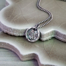 Load image into Gallery viewer, A silver flower pendant necklace with a vintage design, featuring a morning glory flower motif, displayed on a textured background.