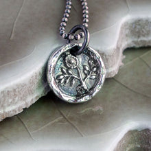 Load image into Gallery viewer, A silver flower pendant necklace with a vintage design, featuring a morning glory flower motif, displayed on a textured background.