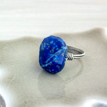 Load image into Gallery viewer, A blue lapis lazuli stone ring on a gray surface