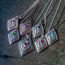 Load image into Gallery viewer, Fine silver thistle pendants with various gemstones against a textured background