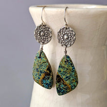 Load image into Gallery viewer, Pair of earrings with green marbled stones and silver tops on a textured white surface.