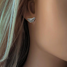 Load image into Gallery viewer, Silver butterfly shaped earring on a mannequin