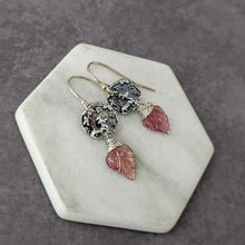 Load image into Gallery viewer, Pair of silver earrings with pink gemstones on a hexagonal stone surface