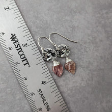 Load image into Gallery viewer, Silver earrings with pink stone drops on a gray surface next to a ruler.