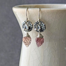 Load image into Gallery viewer, Silver earrings with pink gemstones hanging from a textured ceramic vase