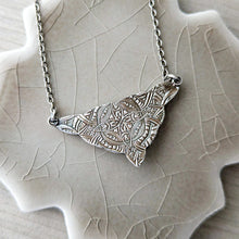Load image into Gallery viewer, Silver necklace reversed on a textured beige surface