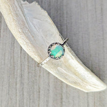 Load image into Gallery viewer, Opal ring on a white stone surface