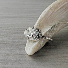Load image into Gallery viewer, Silver ring with intricate design on a stone surface