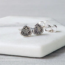 Load image into Gallery viewer, Silver earrings with intricate designs on a white surface