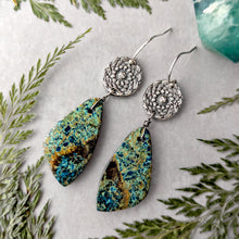 Load image into Gallery viewer, Pair of silver earrings with green and blue stone drops on a light background with green leaves.