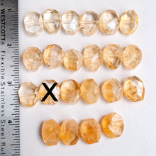 Load image into Gallery viewer, Transparent yellow beads with a ruler on the left side for size reference.

