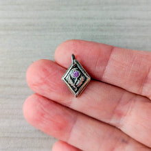 Load image into Gallery viewer, Silver pendant with a pink gemstone held between fingers on a neutral background
