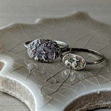 Load image into Gallery viewer, Two silver rings on a textured ceramic surface
