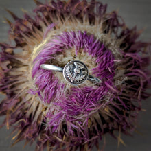 Load image into Gallery viewer, Silver ring with a circular floral design on a purple flower
