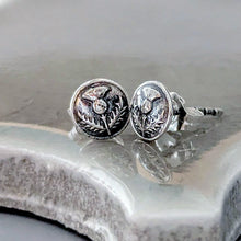 Load image into Gallery viewer, Silver round earrings with intricate designs on a reflective surface
