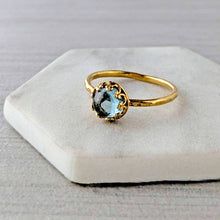 Load image into Gallery viewer, Gold ring with a blue green gemstone on a white background
