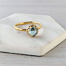 Load image into Gallery viewer, Gold ring with a blue green gemstone on a white background

