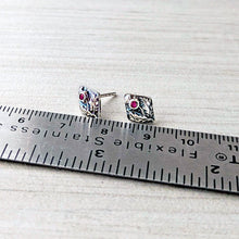 Load image into Gallery viewer, Silver earrings with gemstones on a ruler for scale on a white background

