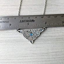 Load image into Gallery viewer, Triangular silver pendant with blue gemstone on a chain, measured against a ruler.
