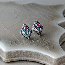 Load image into Gallery viewer, Silver earrings with gemstones on a textured stone surface
