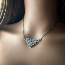 Load image into Gallery viewer, Silver necklace with a triangular pendant and blue gemstone on a mannequin
