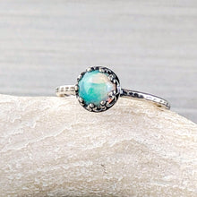 Load image into Gallery viewer, Silver ring with an opal stone on a stone surface
