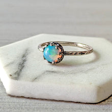Load image into Gallery viewer, Silver ring with an opal stone on a marble surface
