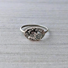 Load image into Gallery viewer, Silver ring with textured design on a light gray background
