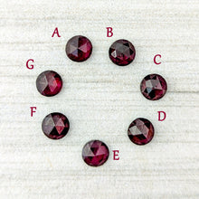 Load image into Gallery viewer, Rose cut garnets labeled A to E on a textured white background
