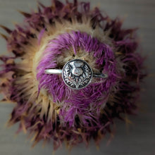 Load image into Gallery viewer, Silver ring with intricate thistle design on a purple dried thistle flower

