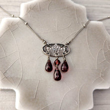 Load image into Gallery viewer, Necklace with a detailed oval pendant and garnet beads
