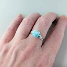 Load image into Gallery viewer, Turquoise color larimar gemstone ring on a hand against a neutral background
