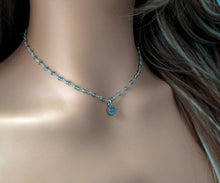 Load image into Gallery viewer, Necklace with a blue pendant and beads on a mannequin
